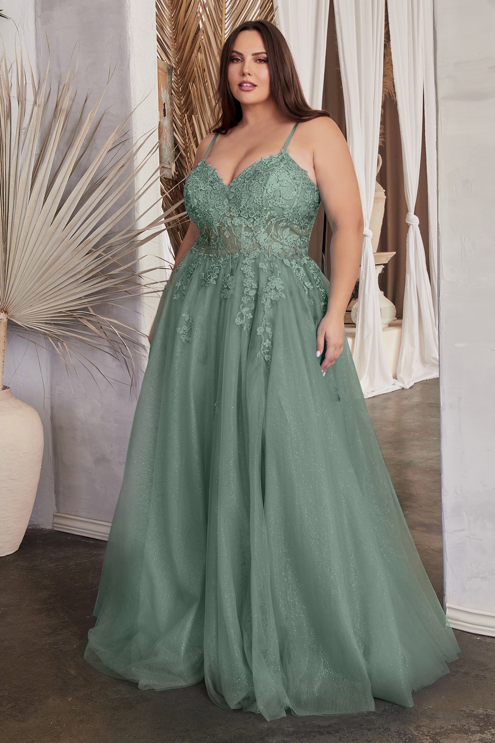 Plus size green tulle prom dress with lace applique bodice and v-neckline, featuring a curve-enhancing A-line silhouette.