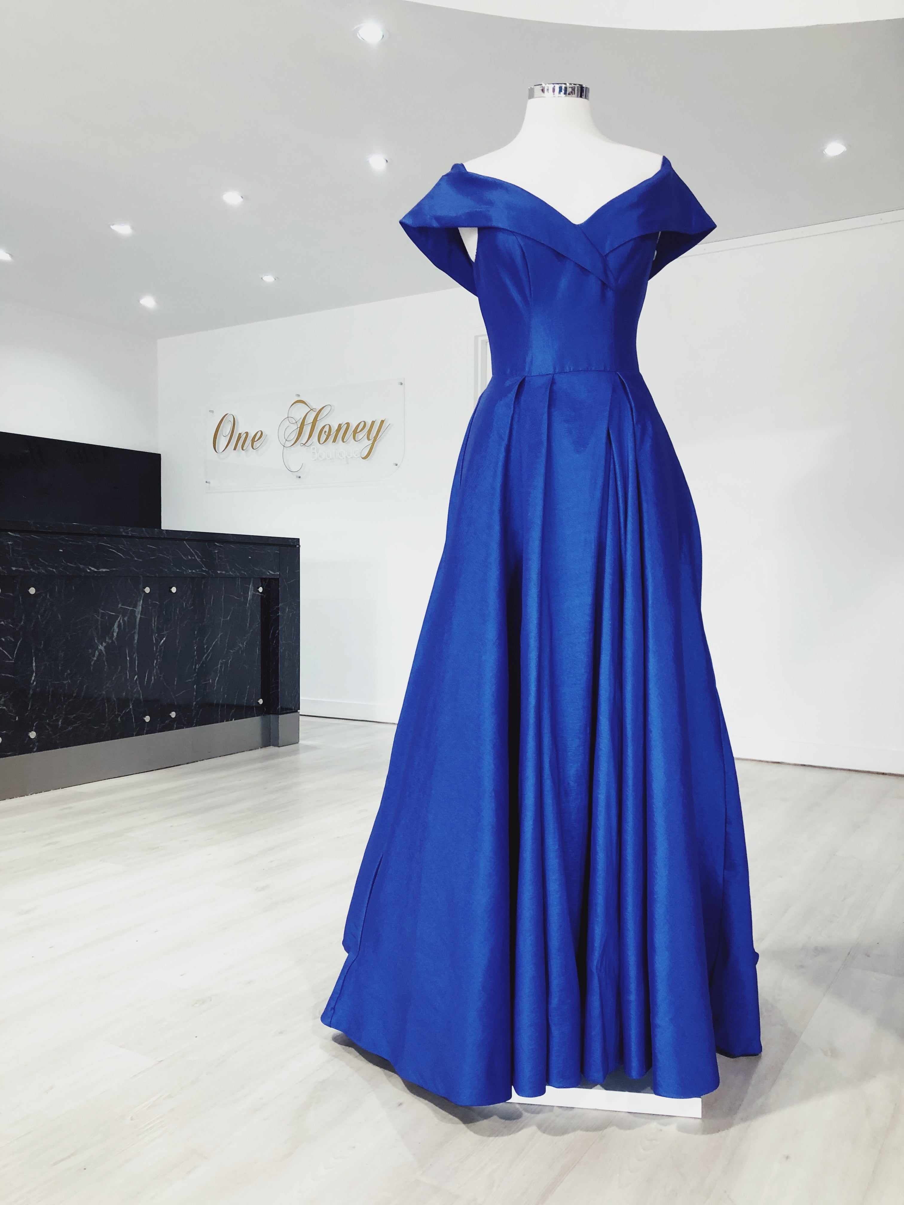 Honey Couture KATY formal dress in royal blue, featuring a princess skirt and off-shoulder design. Perfect for prom or evening events.