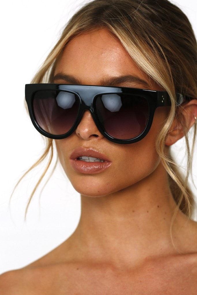 Woman wearing Honey Couture SELENA Flat Top Inspired Sunglasses, designer fashion from Australian Formal Store, tortoise detail, durable.