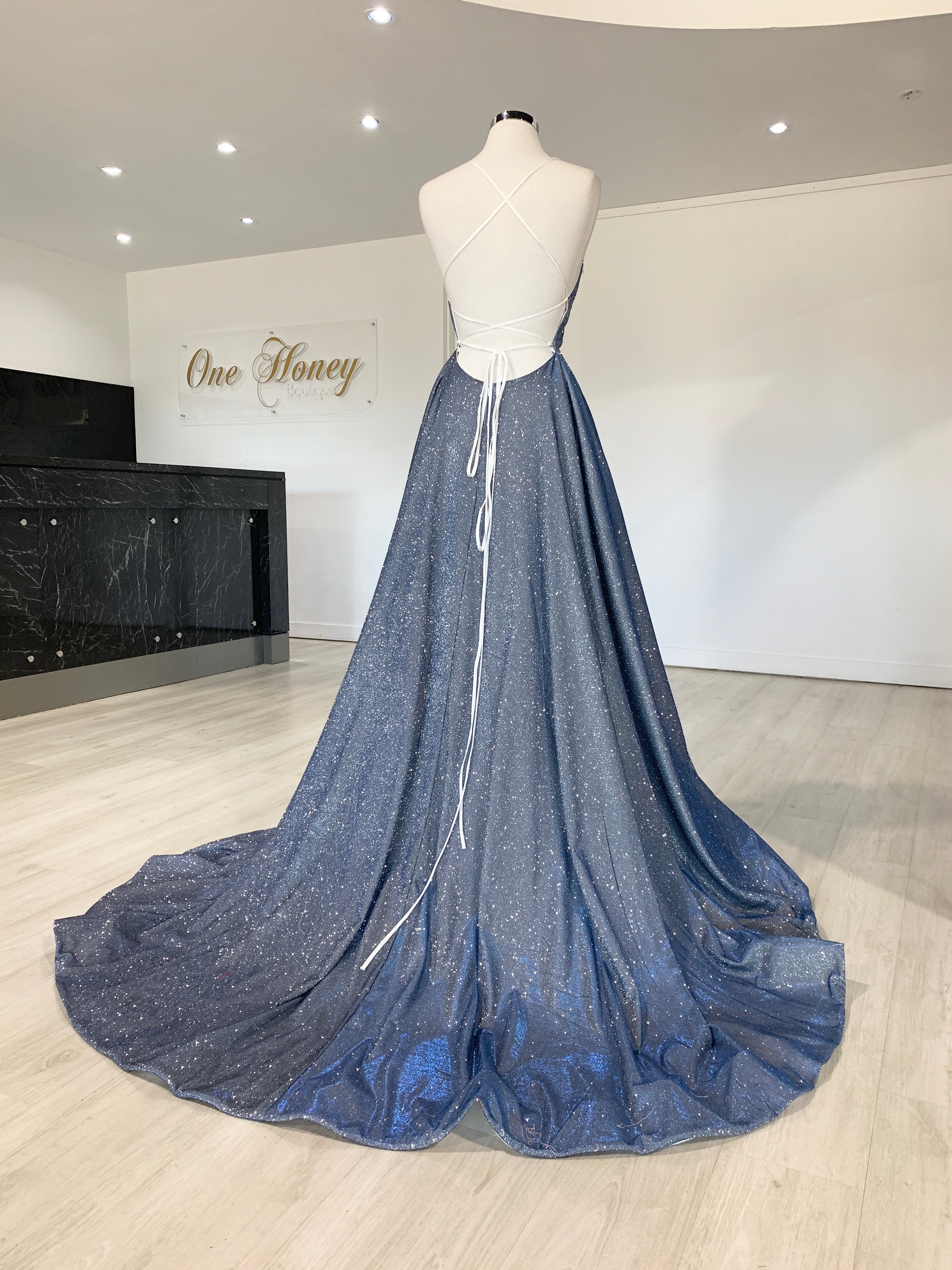 Back view of Honey Couture HARRIETT Glitter Fabric Lace Up Back Formal Dress in blue with full train, perfect for pageants and formal events.