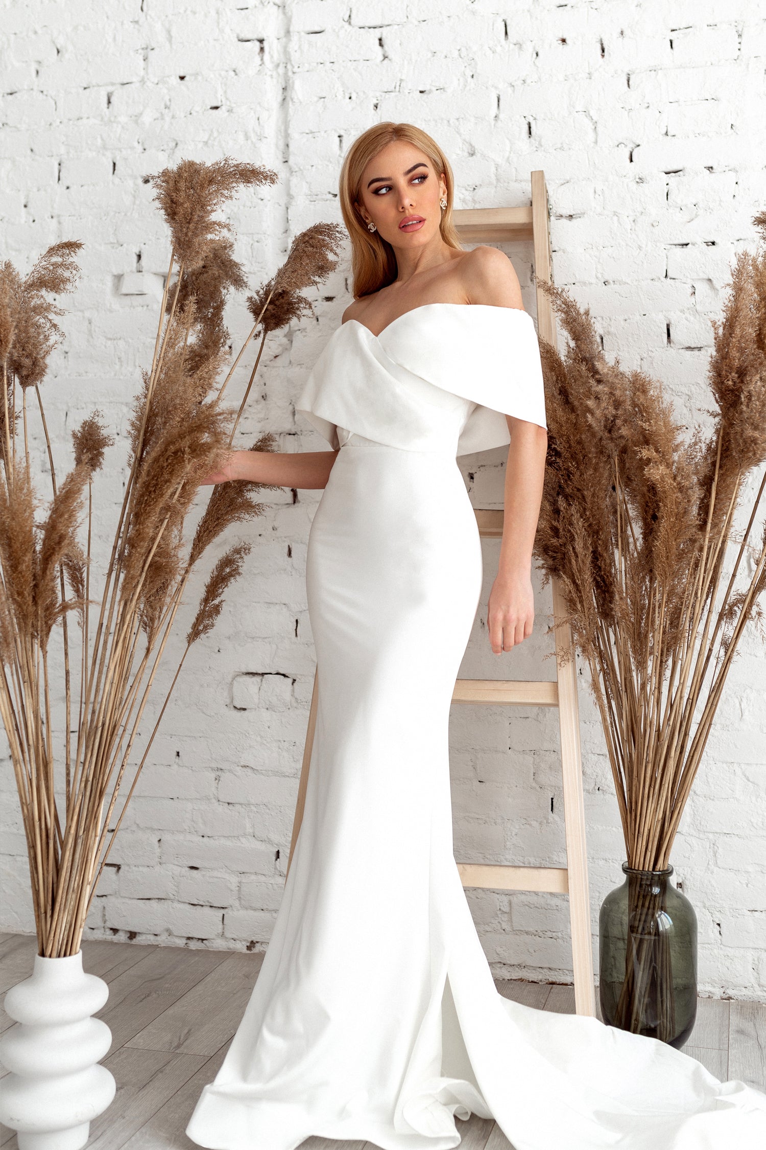 TINA HOLLY COUTURE TK007W off-shoulder mermaid wedding dress with satin finish, worn by a model, Brisbane to Gold Coast.
