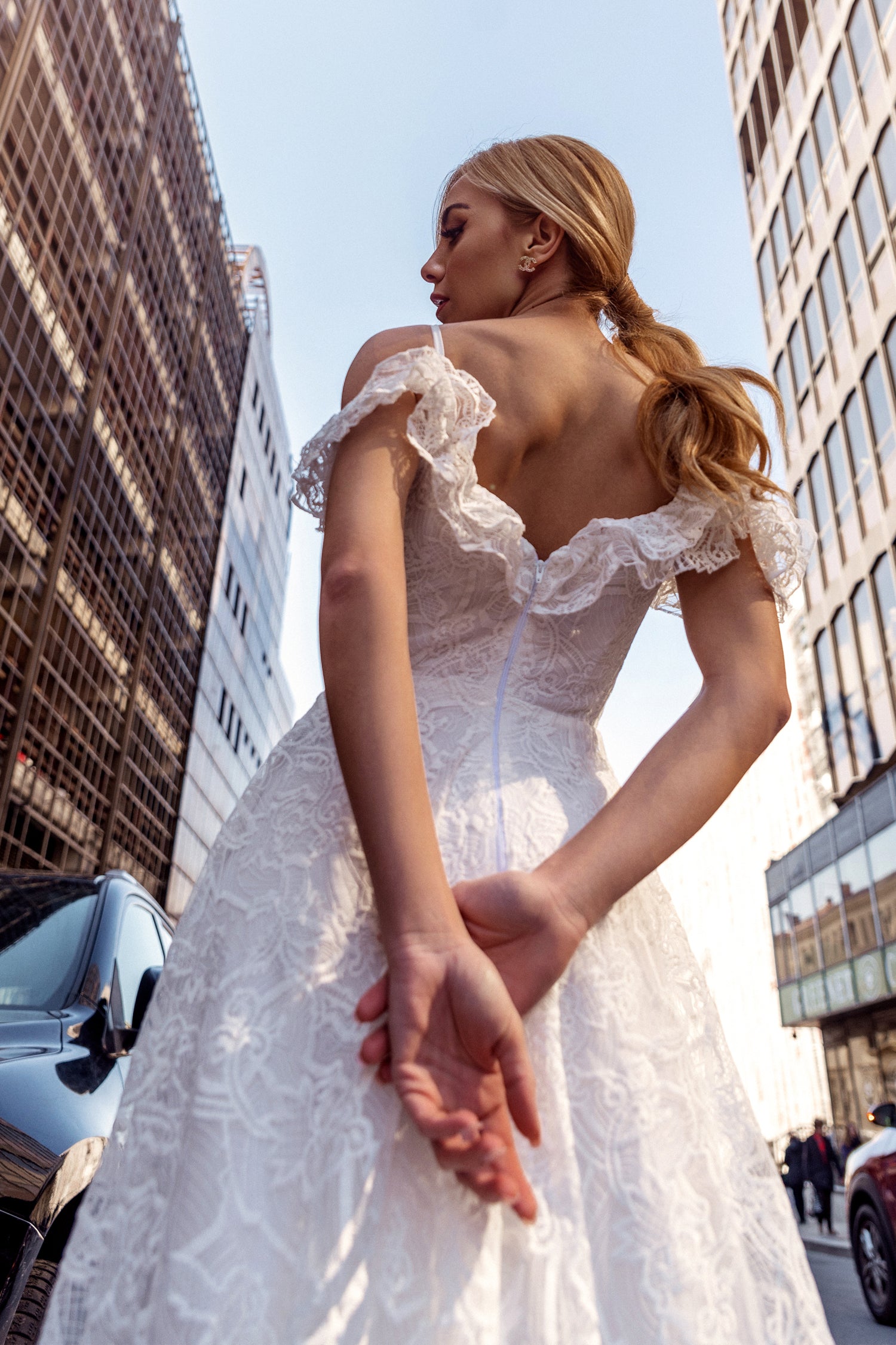 TINA HOLLY COUTURE TK011W lace off-shoulder A-line wedding dress, city backdrop, Brisbane to Gold Coast