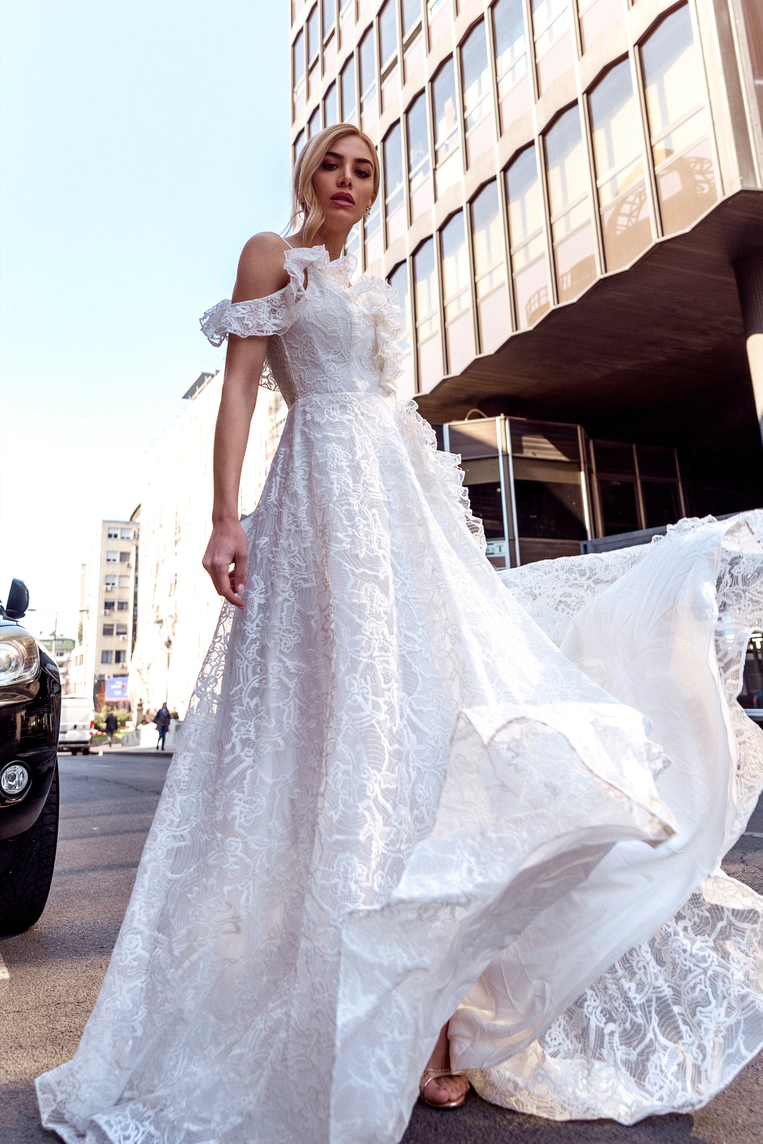 TINA HOLLY COUTURE TK011W lace off-shoulder wedding dress with A-line silhouette, city backdrop, Brisbane to Gold Coast, Australia.