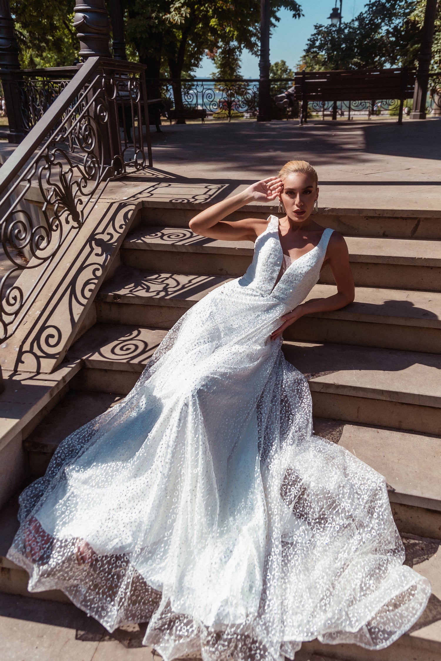 TINA HOLLY COUTURE TW027B white lace A-line wedding dress, V-neck, seated on stairs, Brisbane to Gold Coast