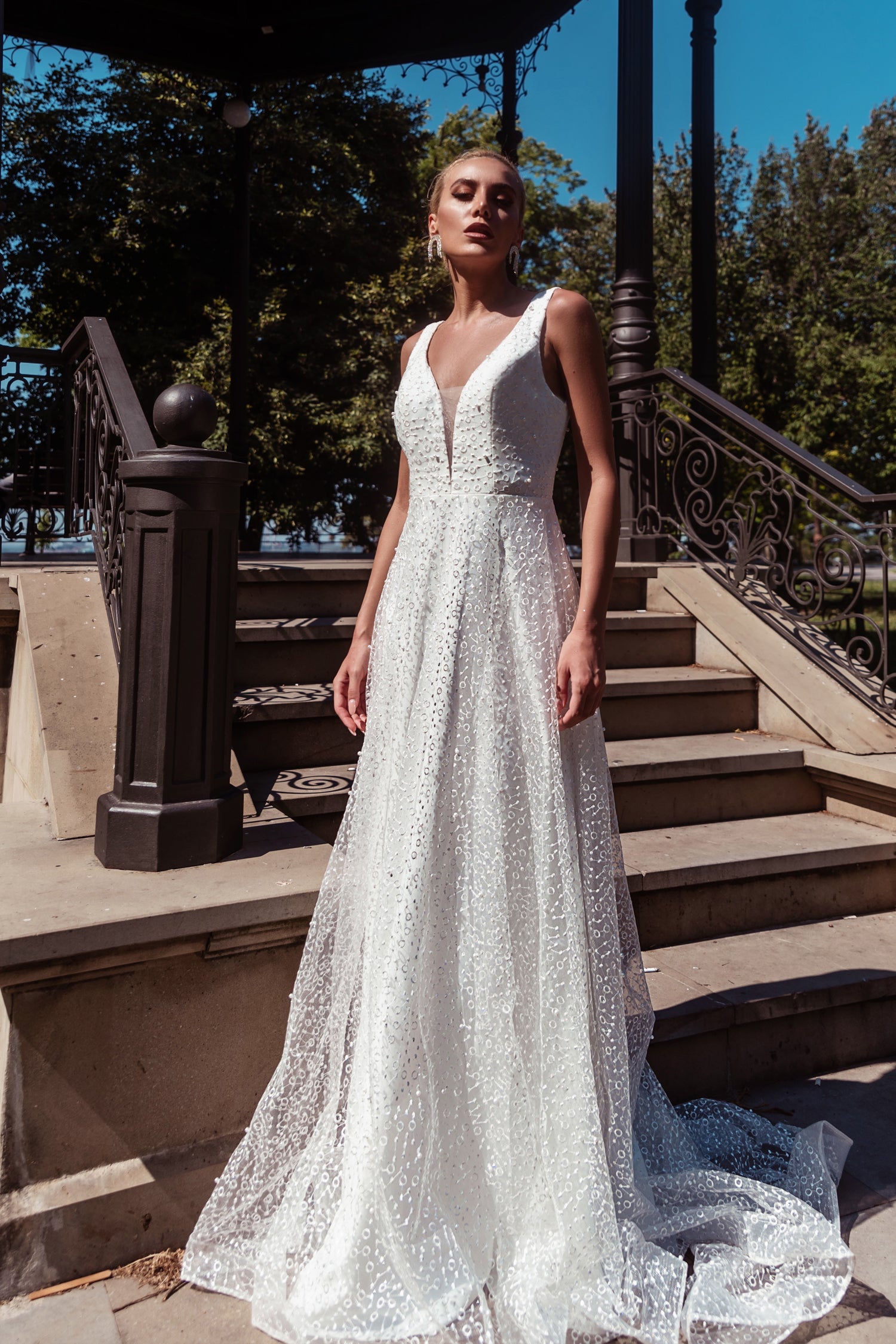 TINA HOLLY COUTURE TW027B white pearl lace A-line wedding dress with deep V front, elegant outdoor setting, Brisbane to Gold Coast