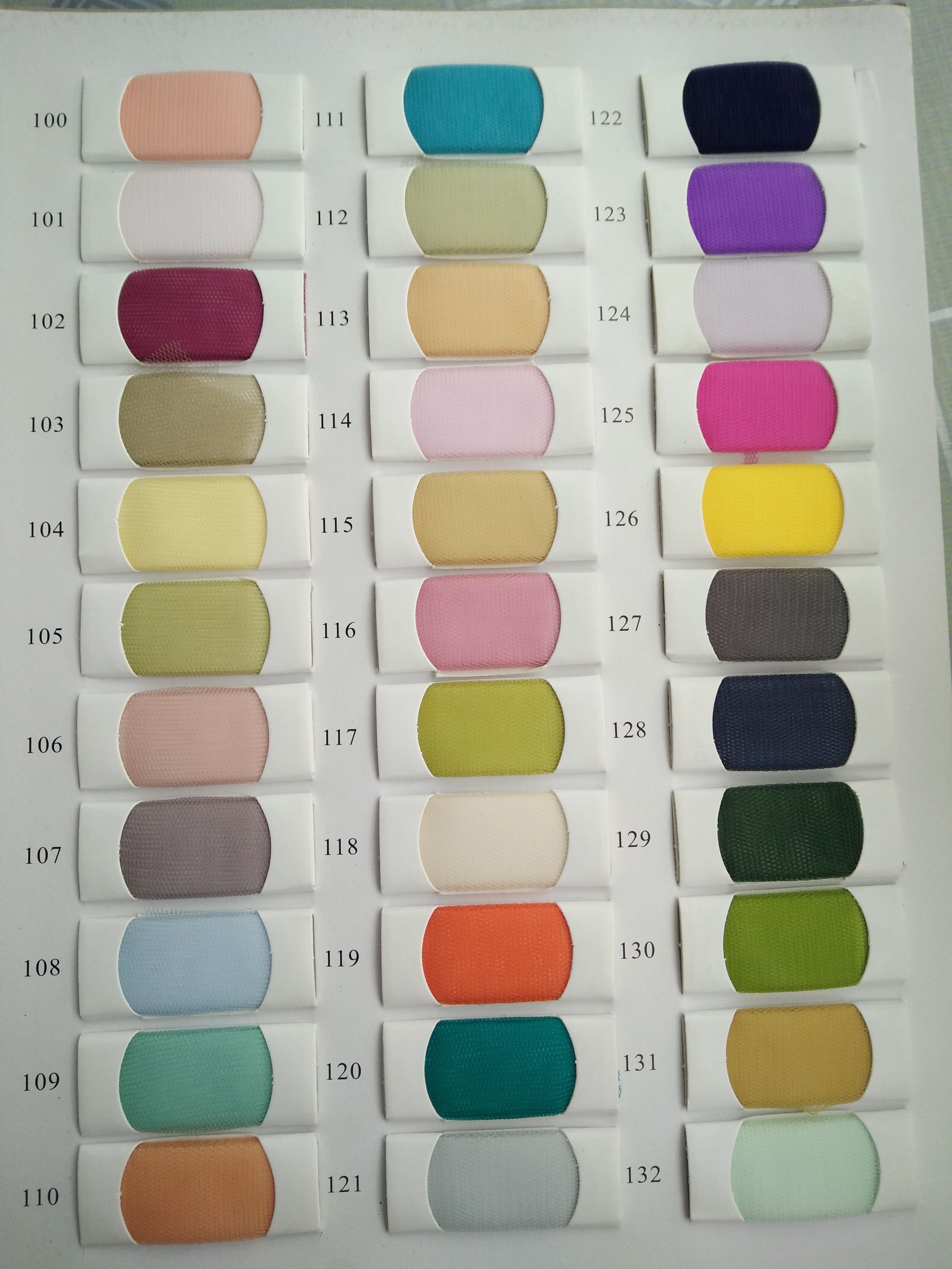 Color swatches chart displaying various fabric options labeled with numbers, including blues, greens, pinks, and neutral tones.