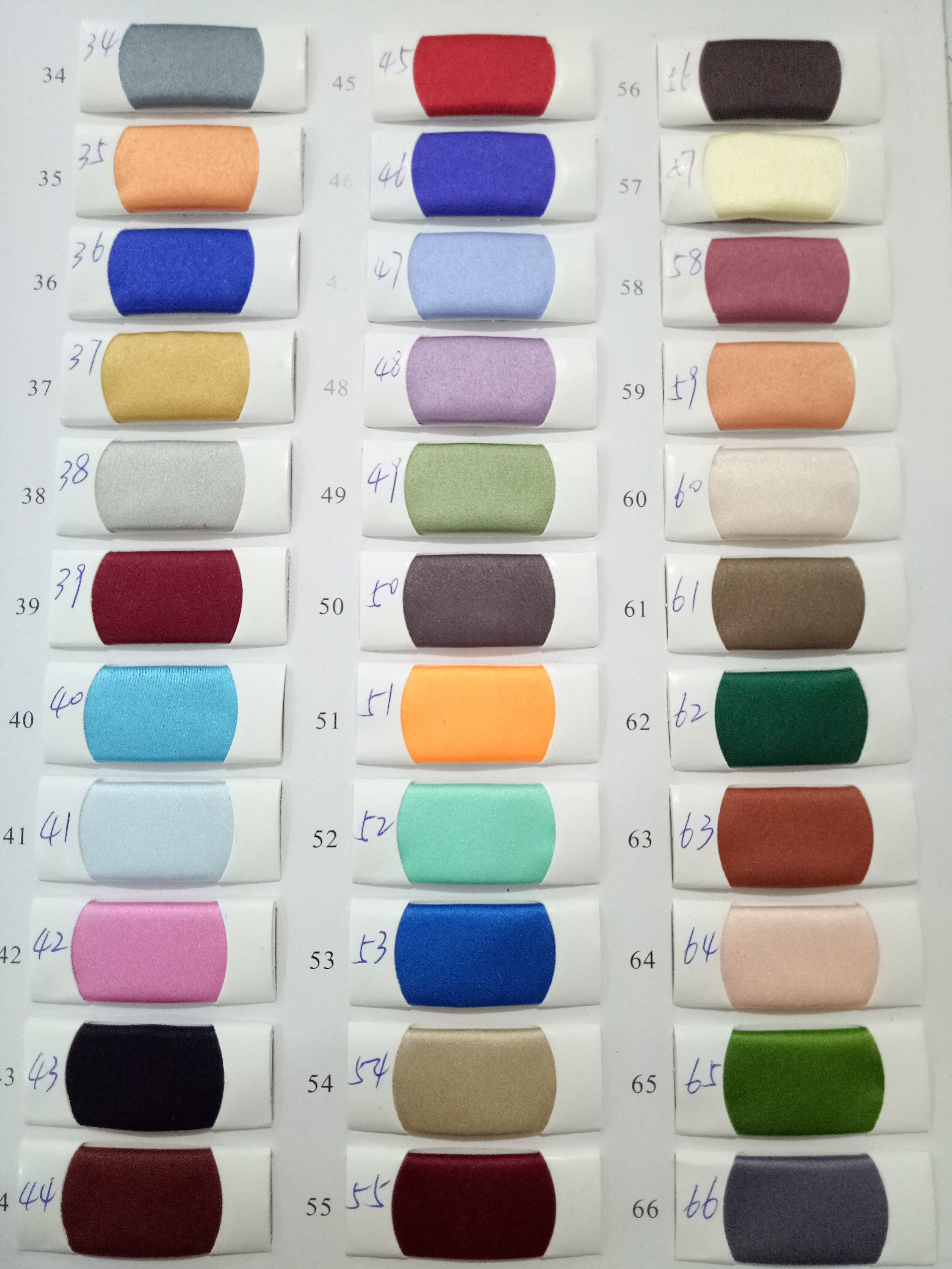 Color swatches display with numbers, showcasing fabric options for design selection.