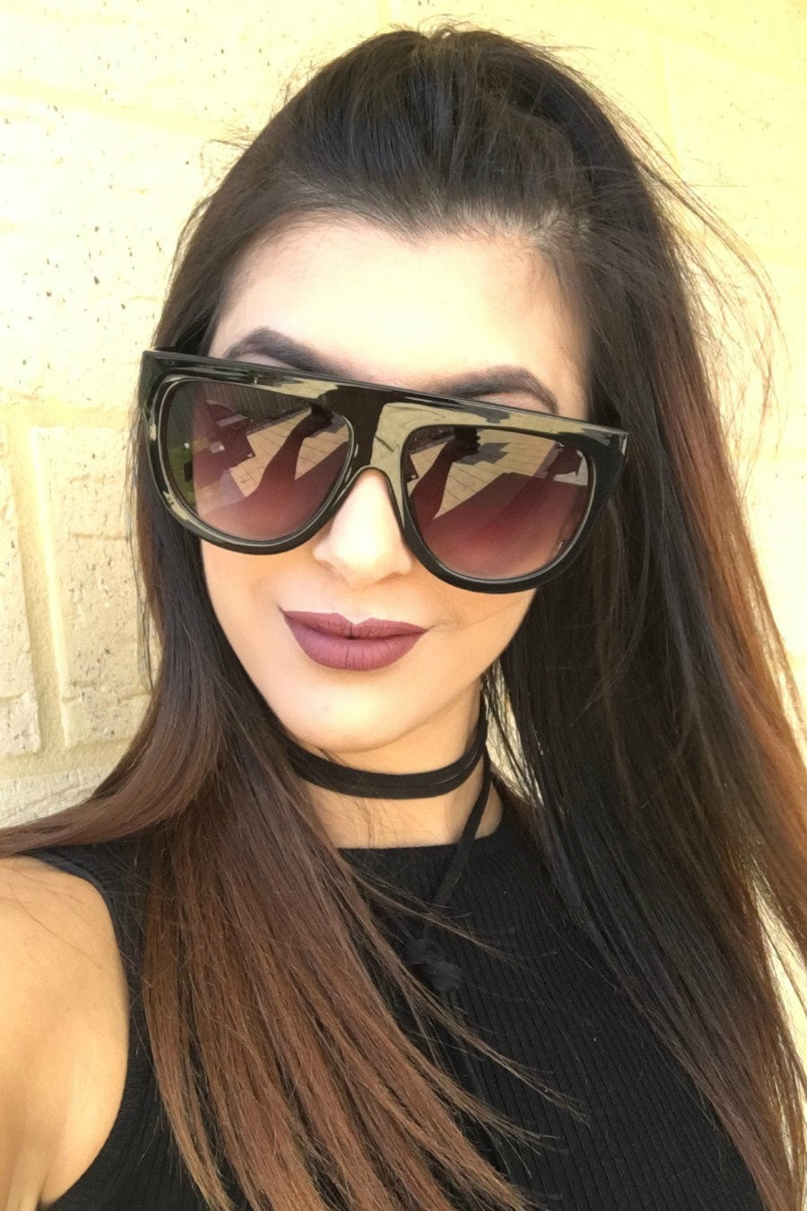Honey Couture SELENA flat top sunglasses on model, featuring sleek design and tortoise detailing. Designer eyewear for bold fashion lovers.