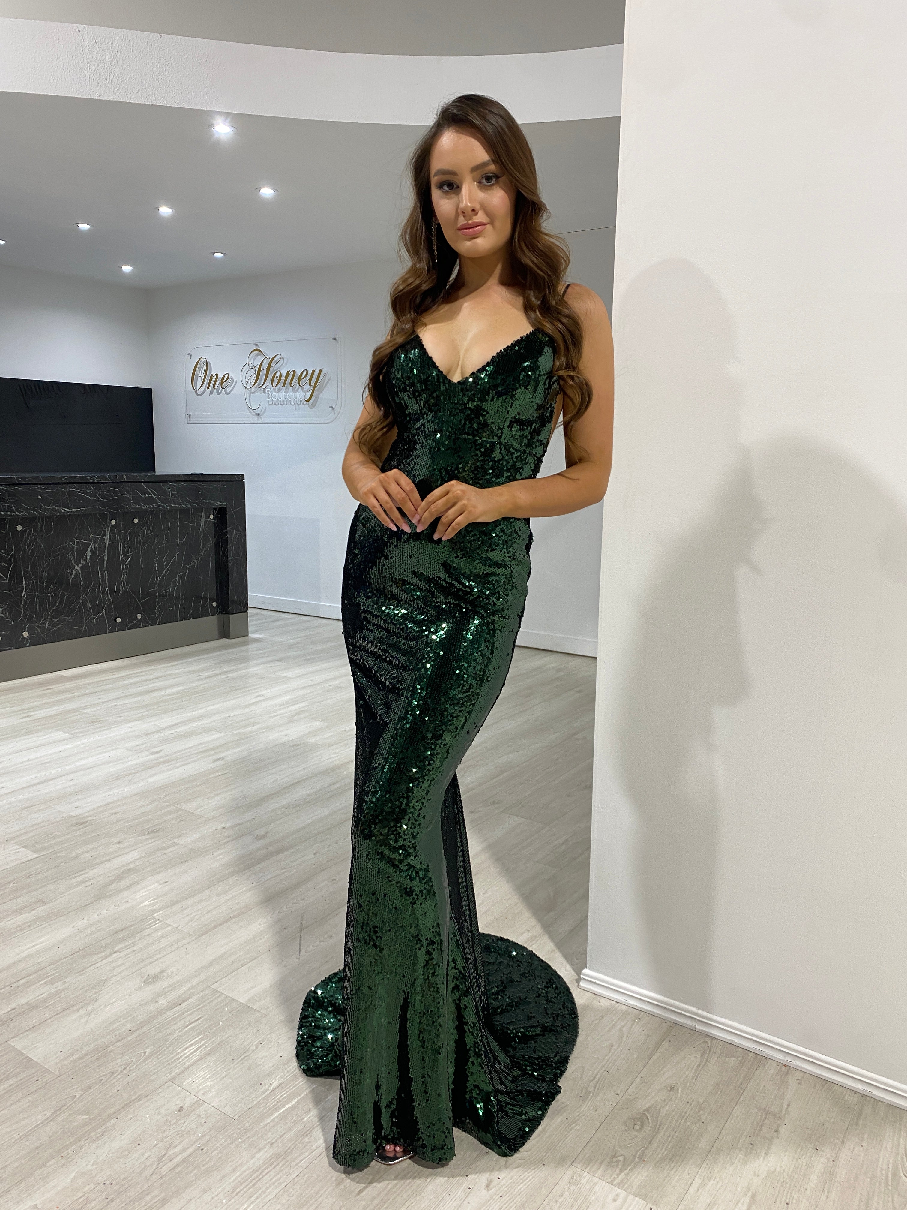 Model wearing Honey Couture KASIA Emerald Sequin Open Back Mermaid Evening Gown, perfect for proms or special occasions by Australian Designer.
