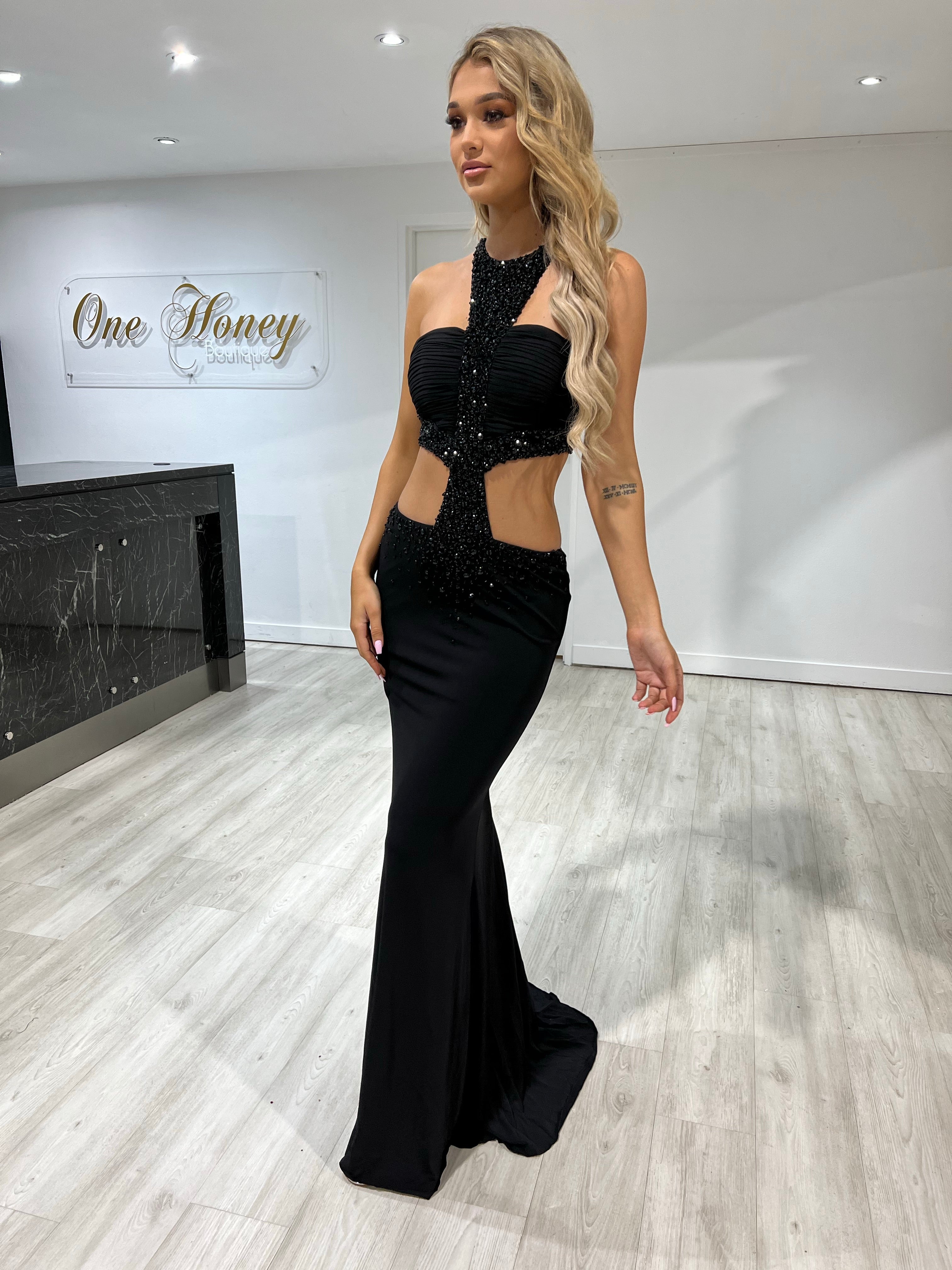 Model wearing Honey Couture RIO Black Halter Cut Out Beaded Formal Gown, Australian Designer style, elegant evening wear.