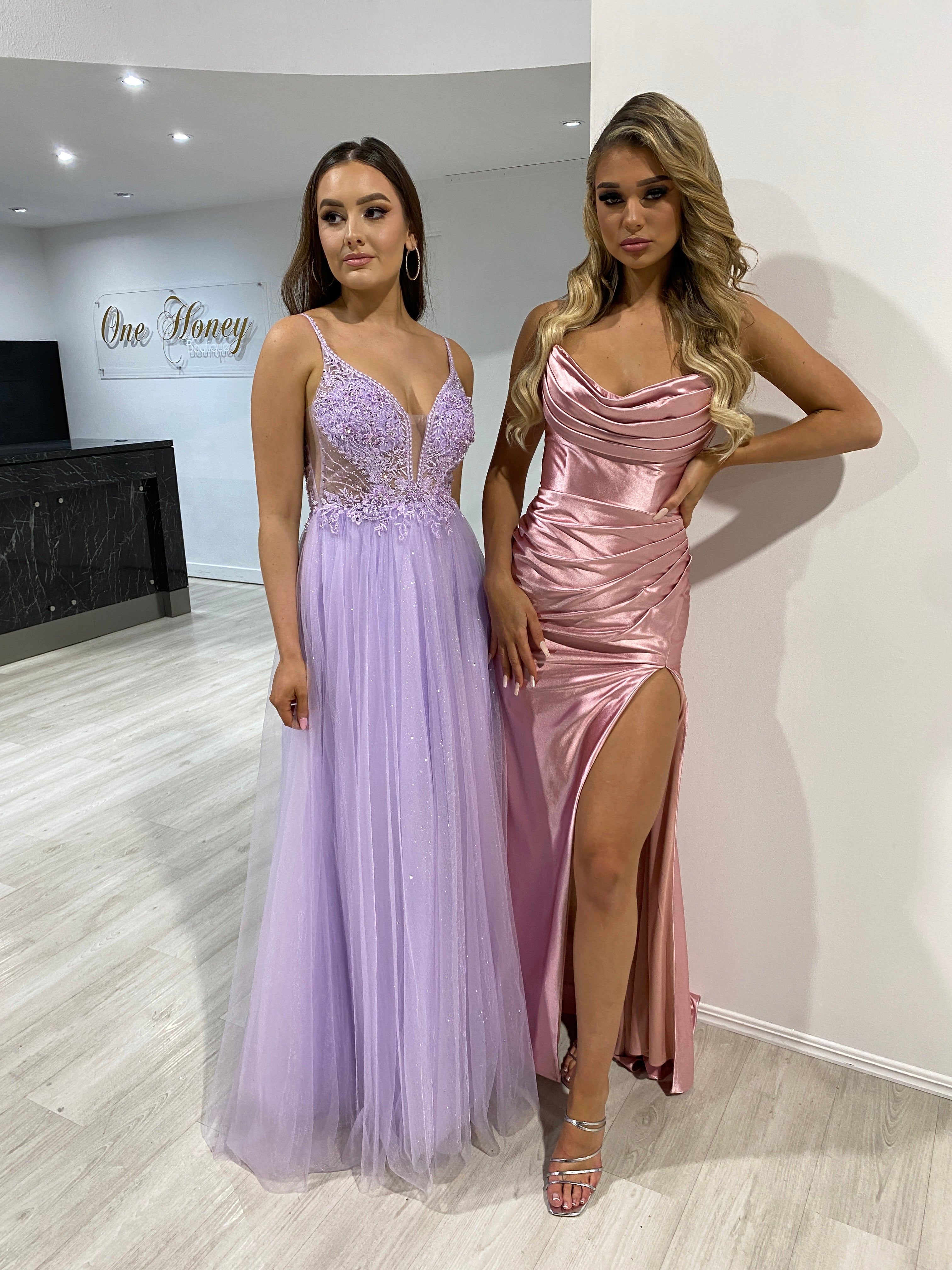 Elegant evening in lilac tulle dress with floral beading and pink satin gown featuring side slit, perfect for formal events.