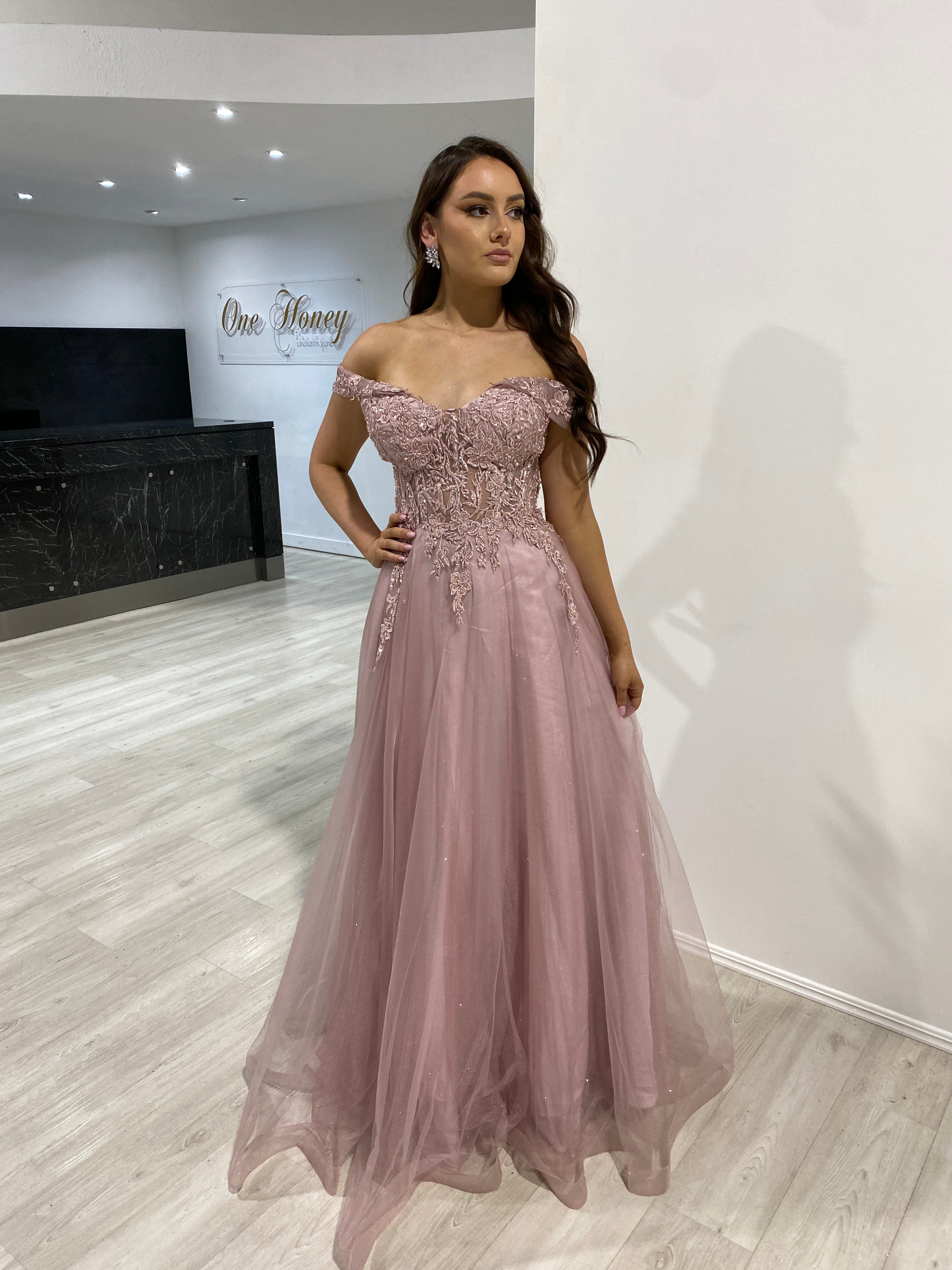 DEJA off-shoulder lace corset ballgown featuring tulle skirt at a formal event. Evening gown perfect for Brisbane to Gold Coast.