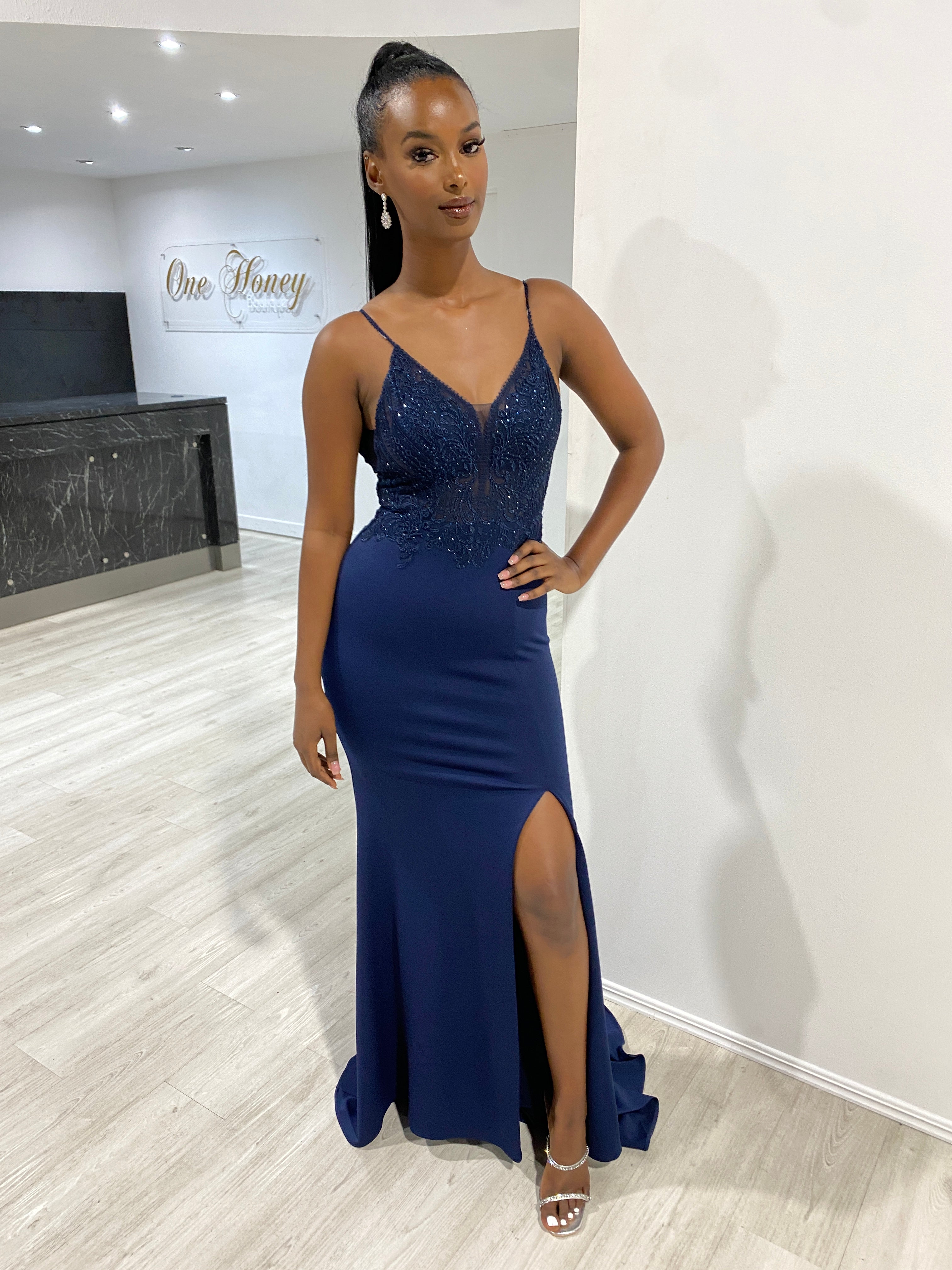Model wearing Honey Couture MIREN Navy Blue Lace Applique Mermaid Formal Dress, an Australian Designer prom gown with a dramatic train.