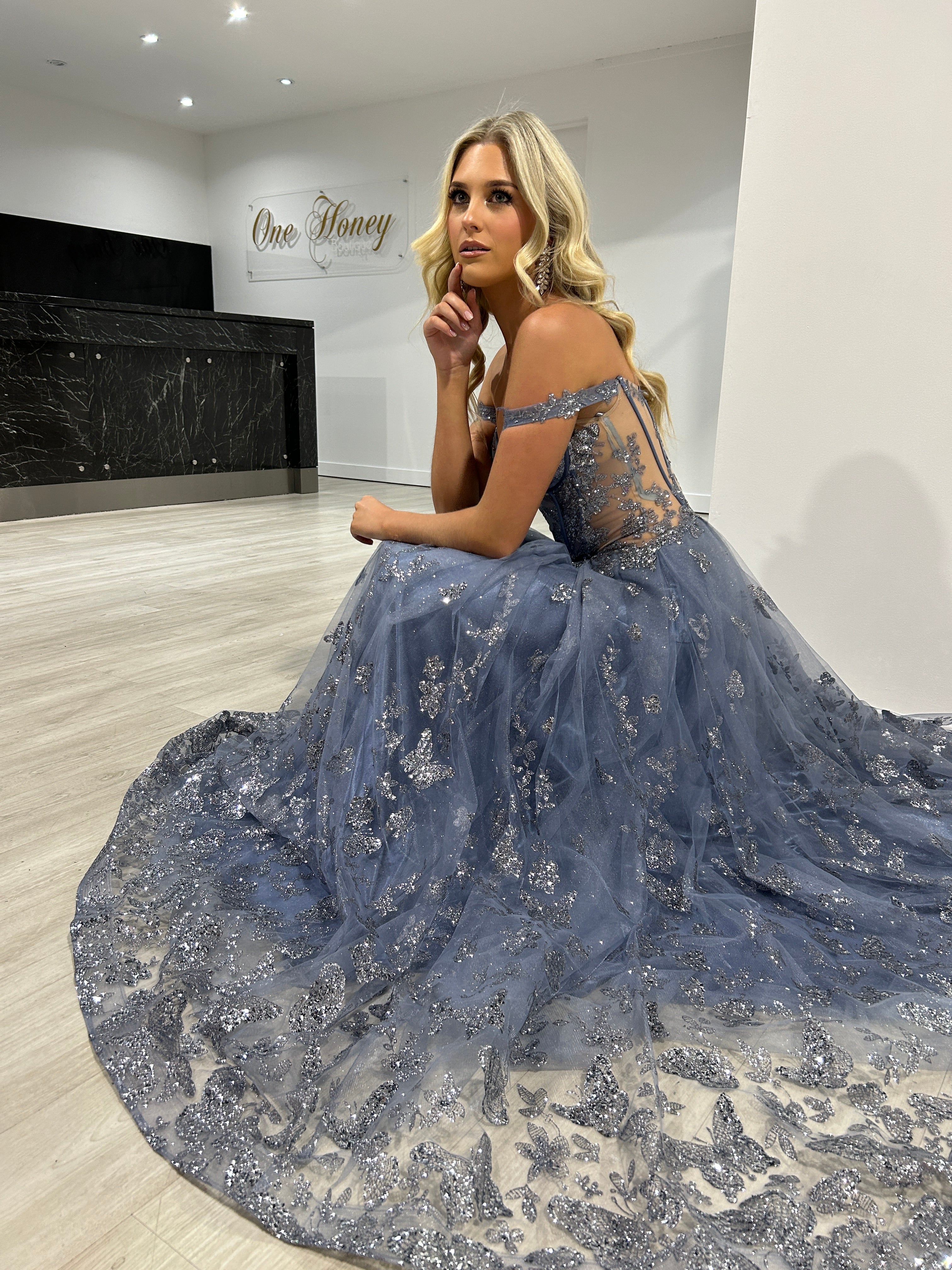 Honey Couture MIST Smokey Blue Glitter Off The Shoulder A-Line Dress in showroom, featuring butterfly pattern, Australian Designer, Prom Dresses.