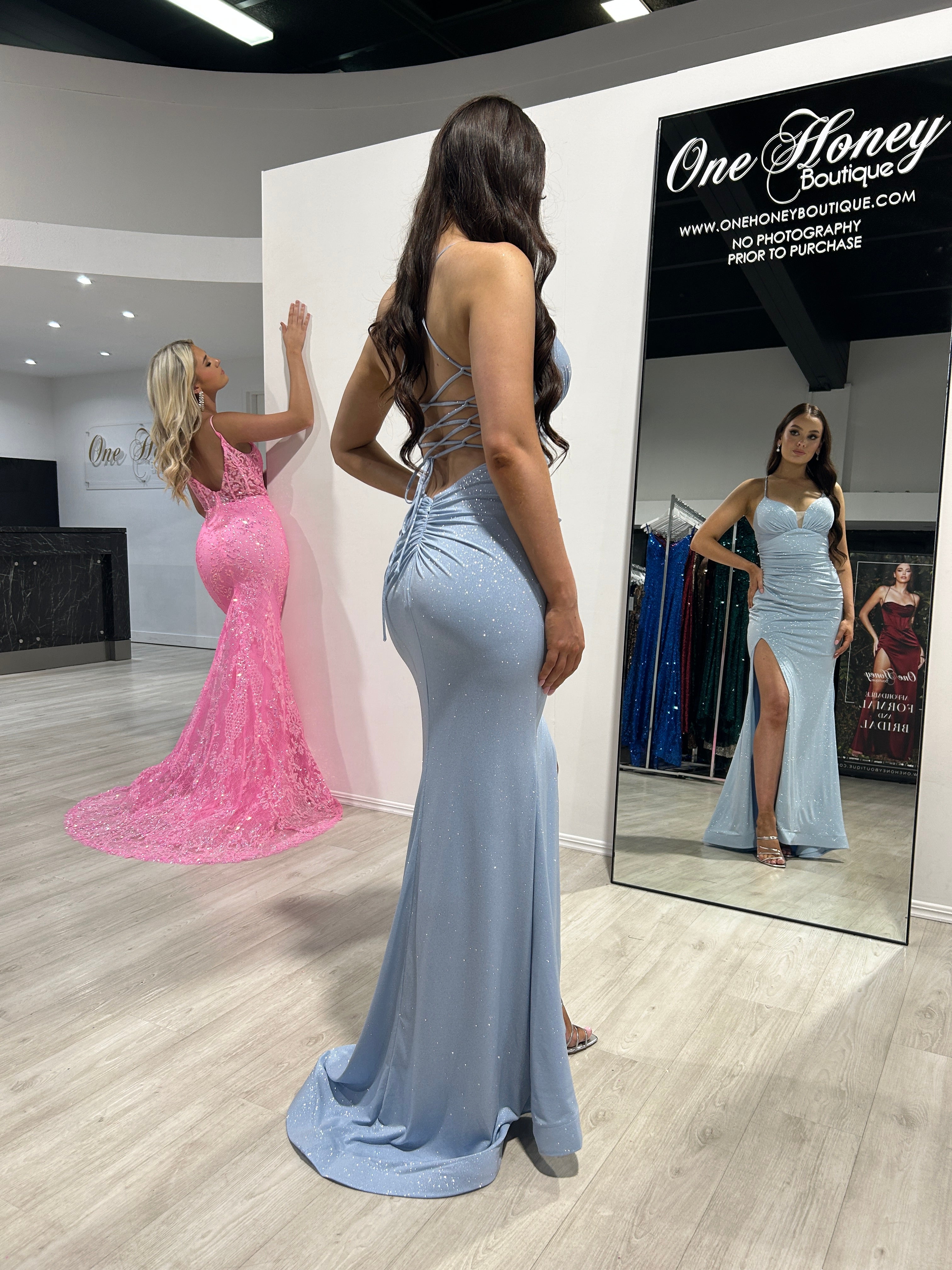 MISTELLA Shimmer Glitter Low Back Mermaid Gown with Corset Detail, perfect for formal events. Stylish women in boutique. Brisbane to Gold Coast.