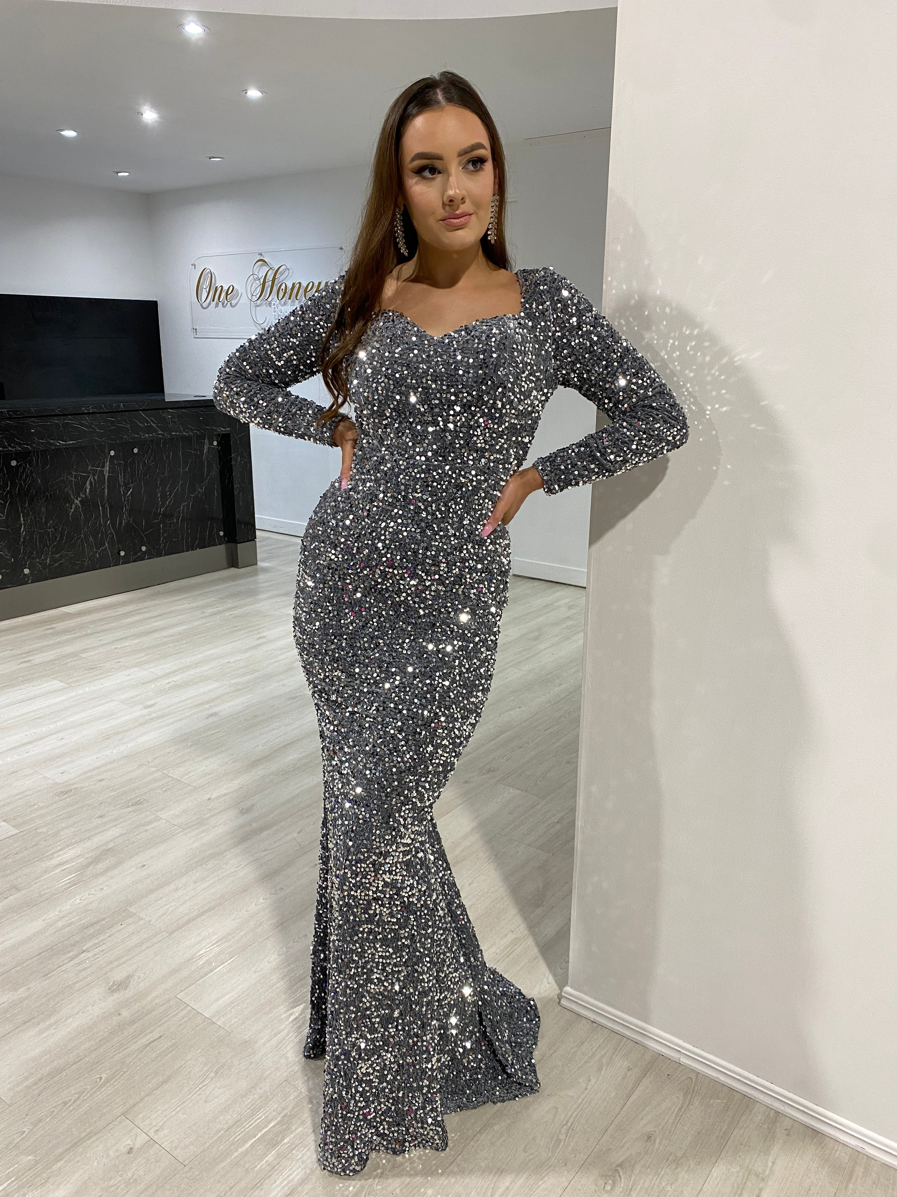 Model wearing Honey Couture ALISON grey silver sequin long sleeve formal dress, Australian designer, perfect for prom or evening events.