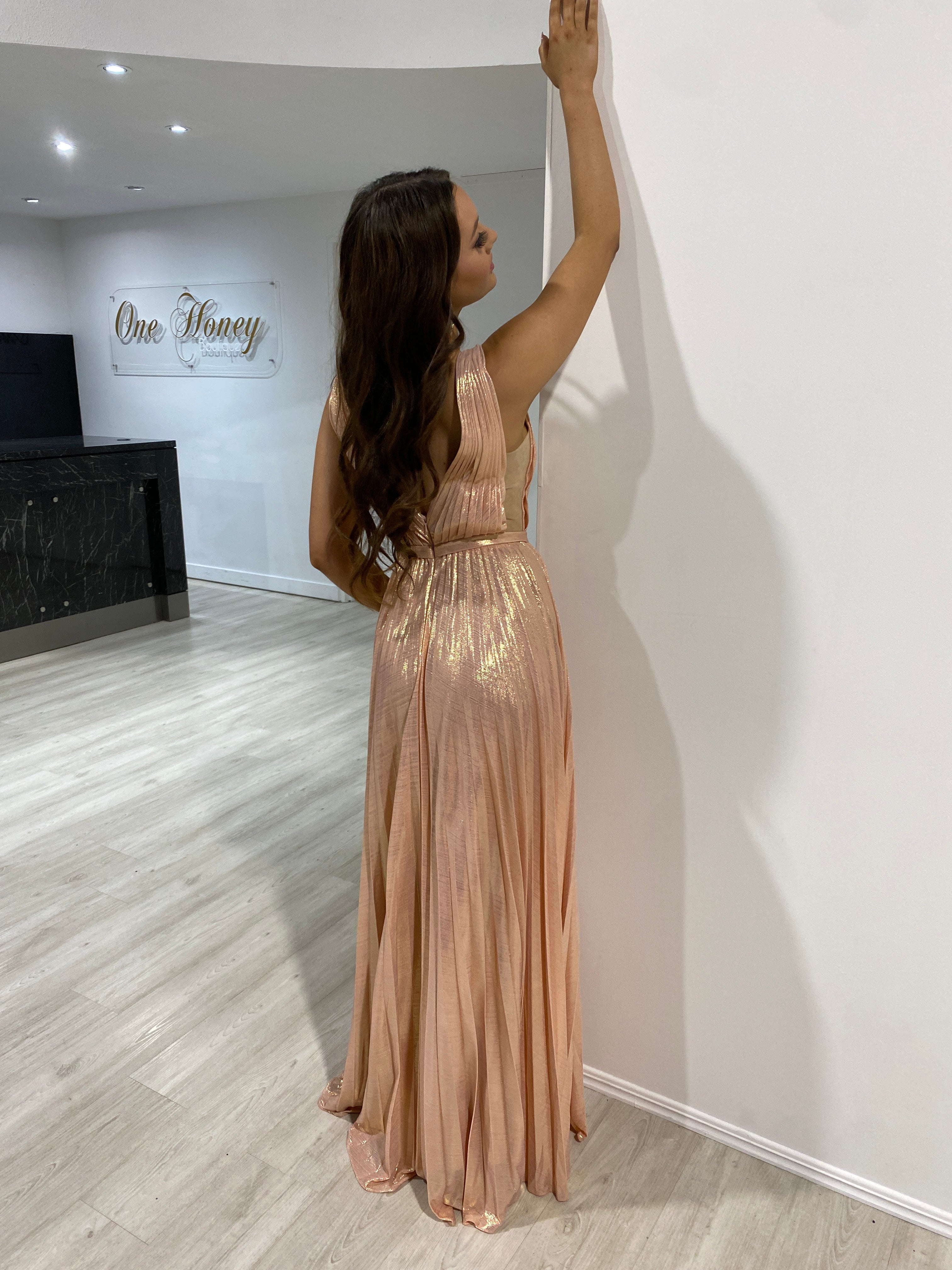 Woman in TRACEY Blush Pink Shimmer Pleated Formal Gown by Honey Couture, Australian Designer, perfect for prom or evening events.