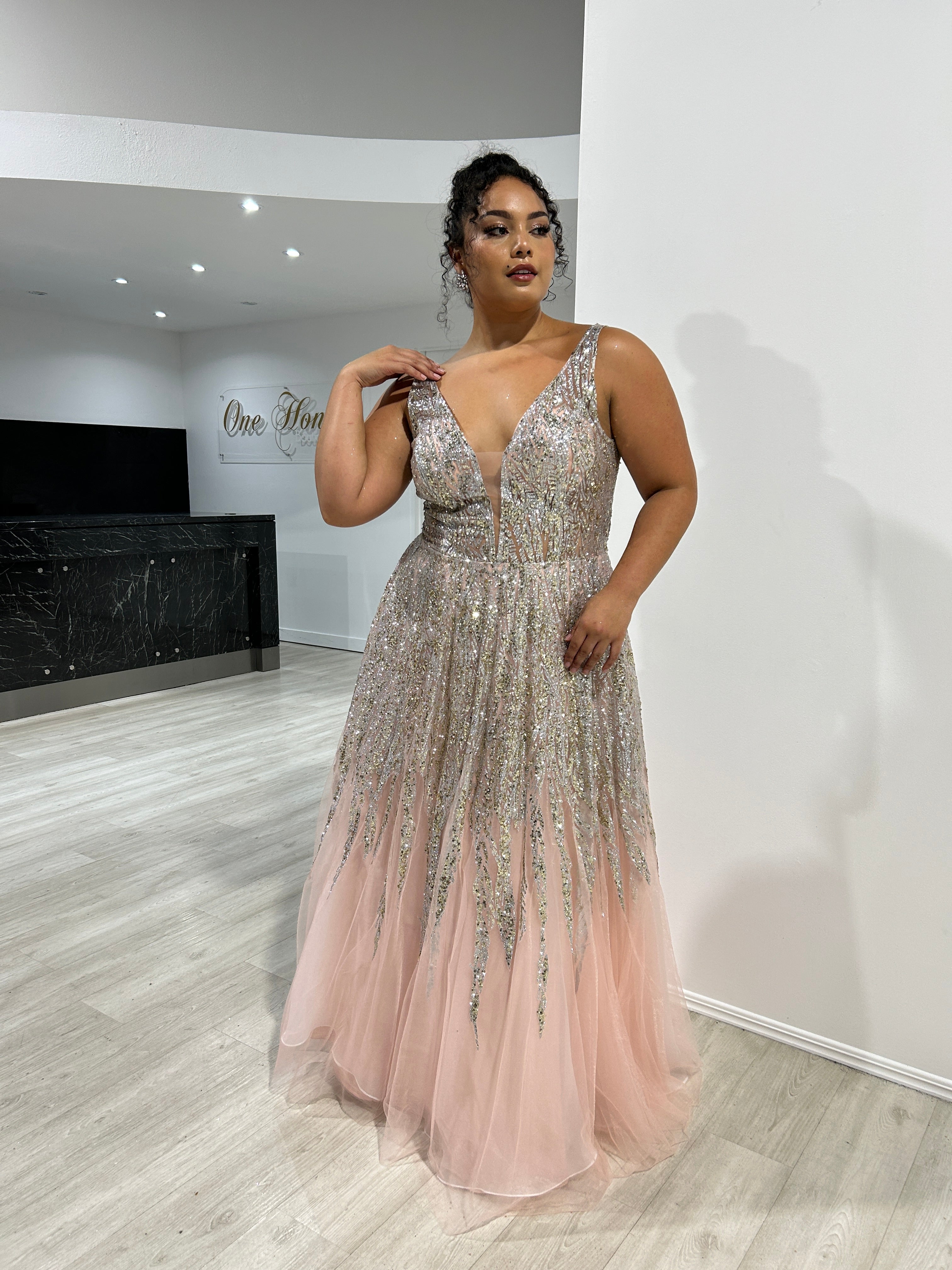 VIANNE Glitter A-Line prom gown with shimmering tulle and bead embellishments. Plunging V-neckline and sultry design. Brisbane to Gold Coast.