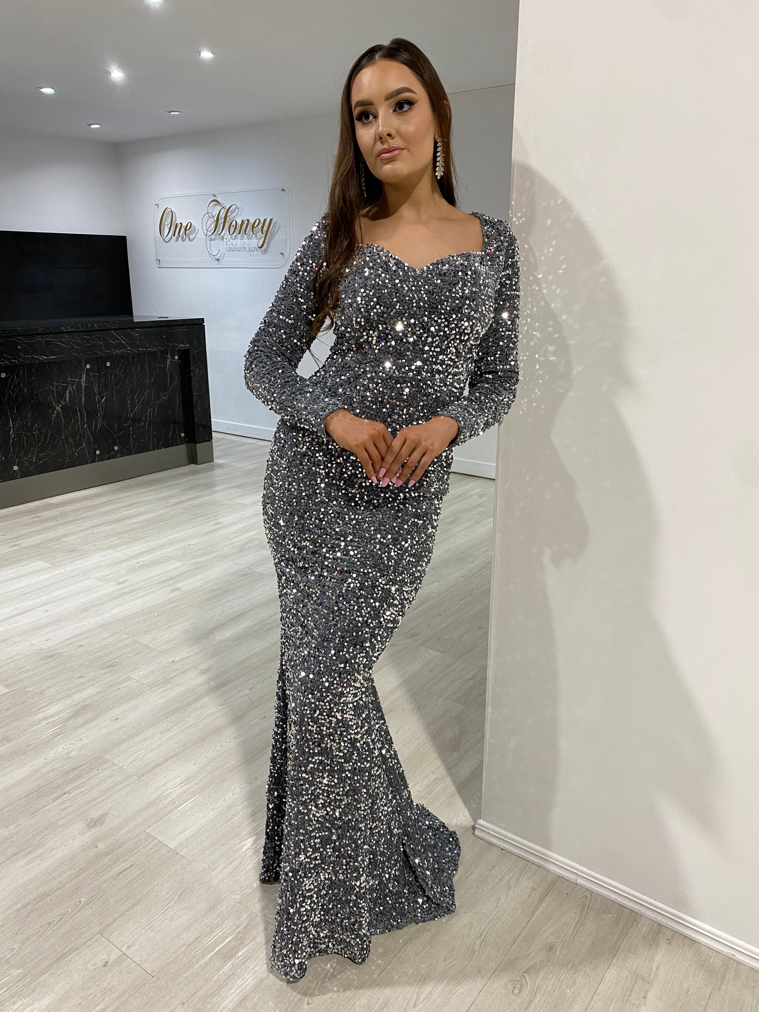 Model wearing Honey Couture ALISON Grey Silver Sequin Long Sleeve Formal Dress, from Australian Designer, perfect for prom and evening events.
