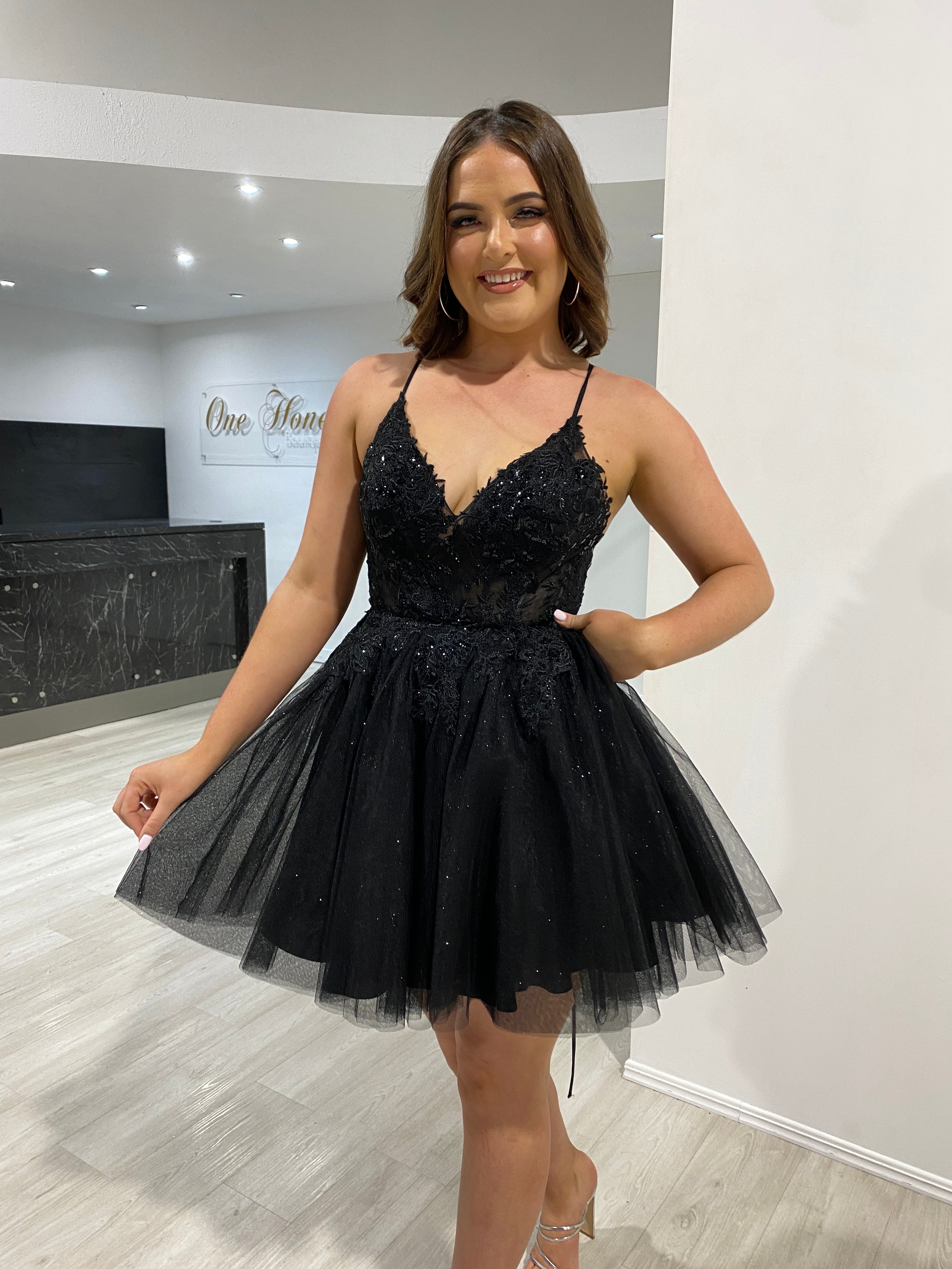 Woman wearing Honey Couture HAVEN Black Glitter Mini Party Dress, tulle skirt, by Australian Designer, perfect for prom or evening events.