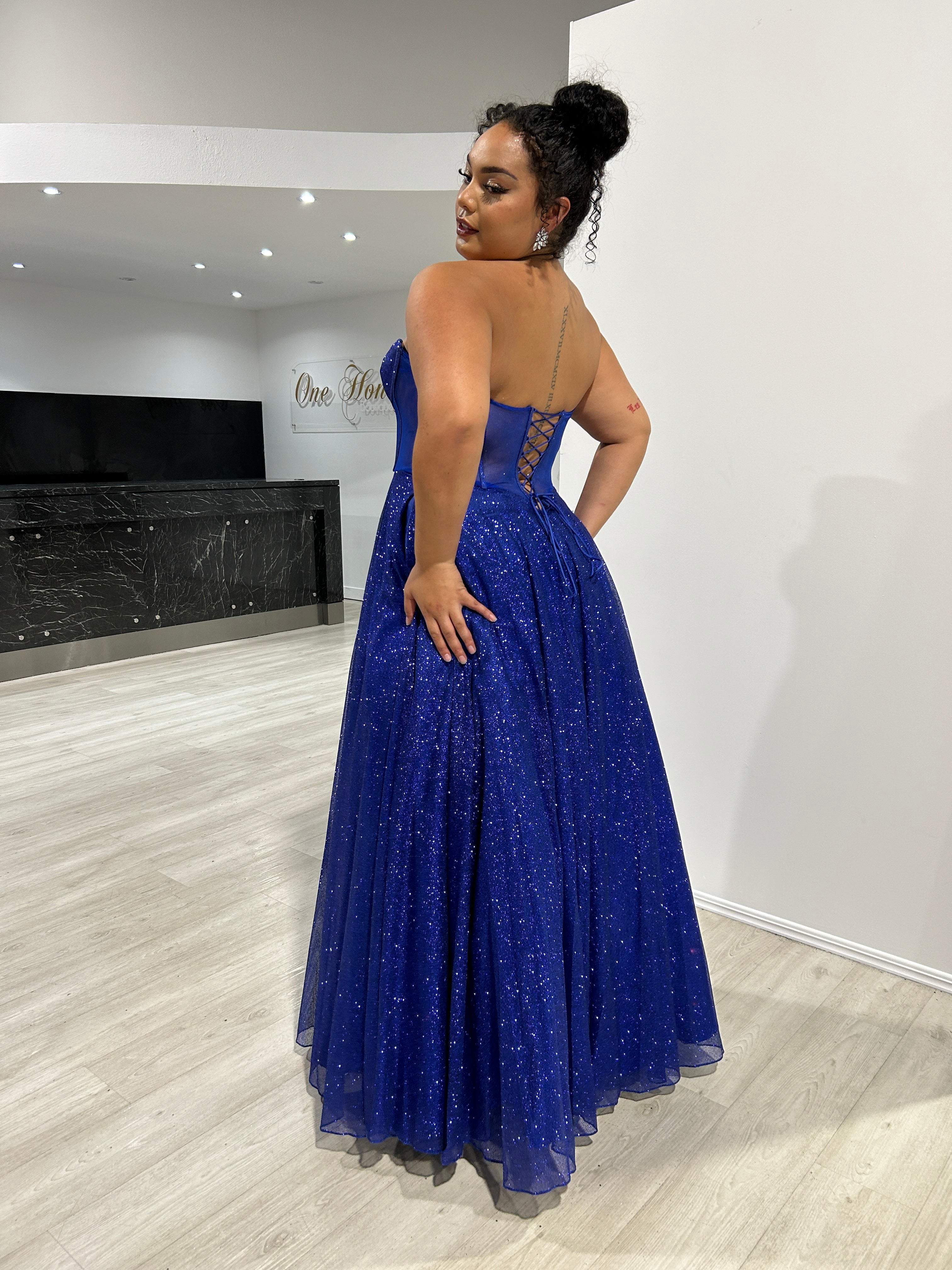 ALOMA Glitter Corset strapless formal dress with a sparkling blue bodice and flowing skirt, perfect for evening events, Brisbane to Gold Coast.