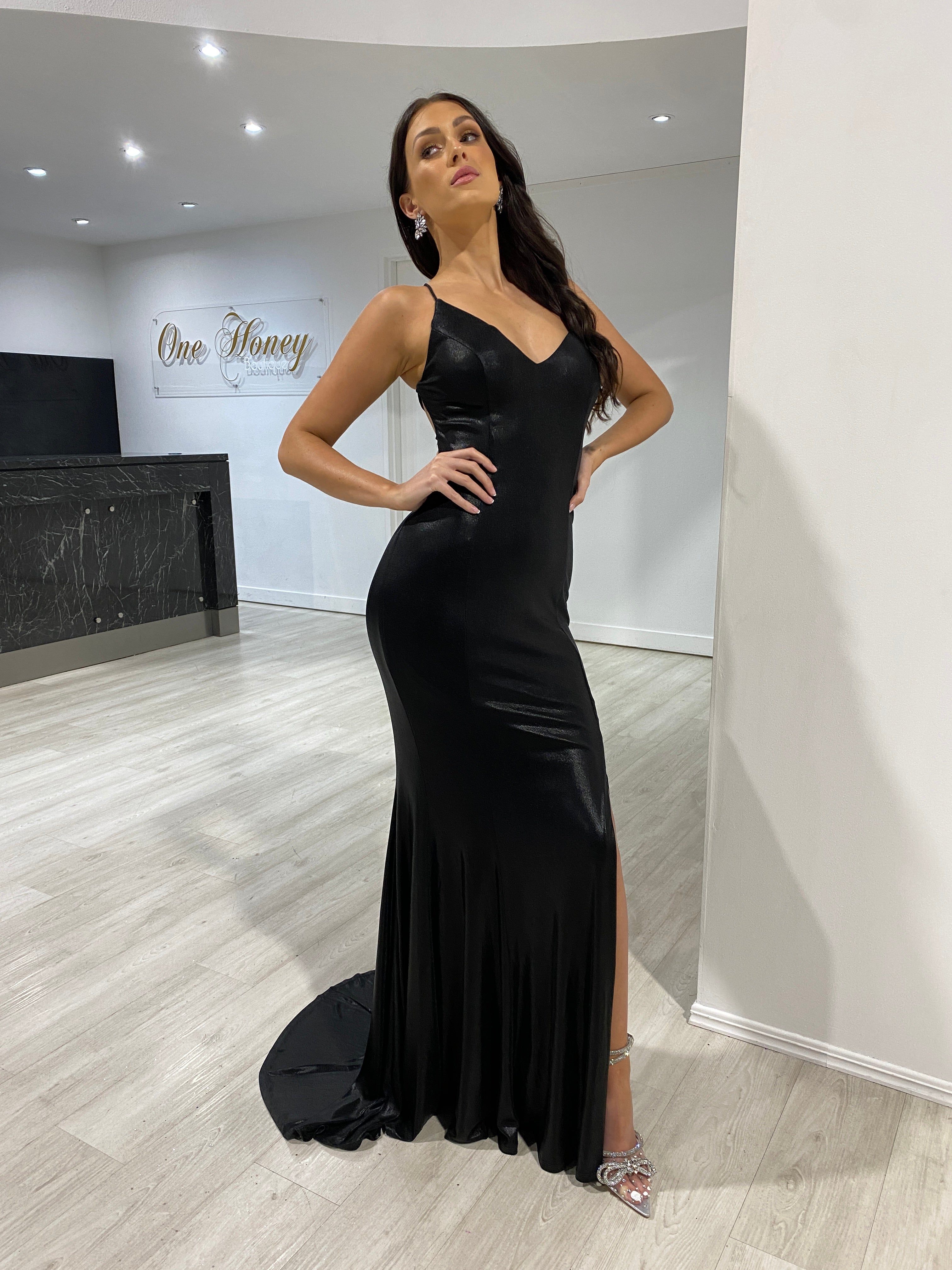Model wearing Honey Couture DITA black lace up corset mermaid formal dress, ideal for prom and evening events by Australian designer.