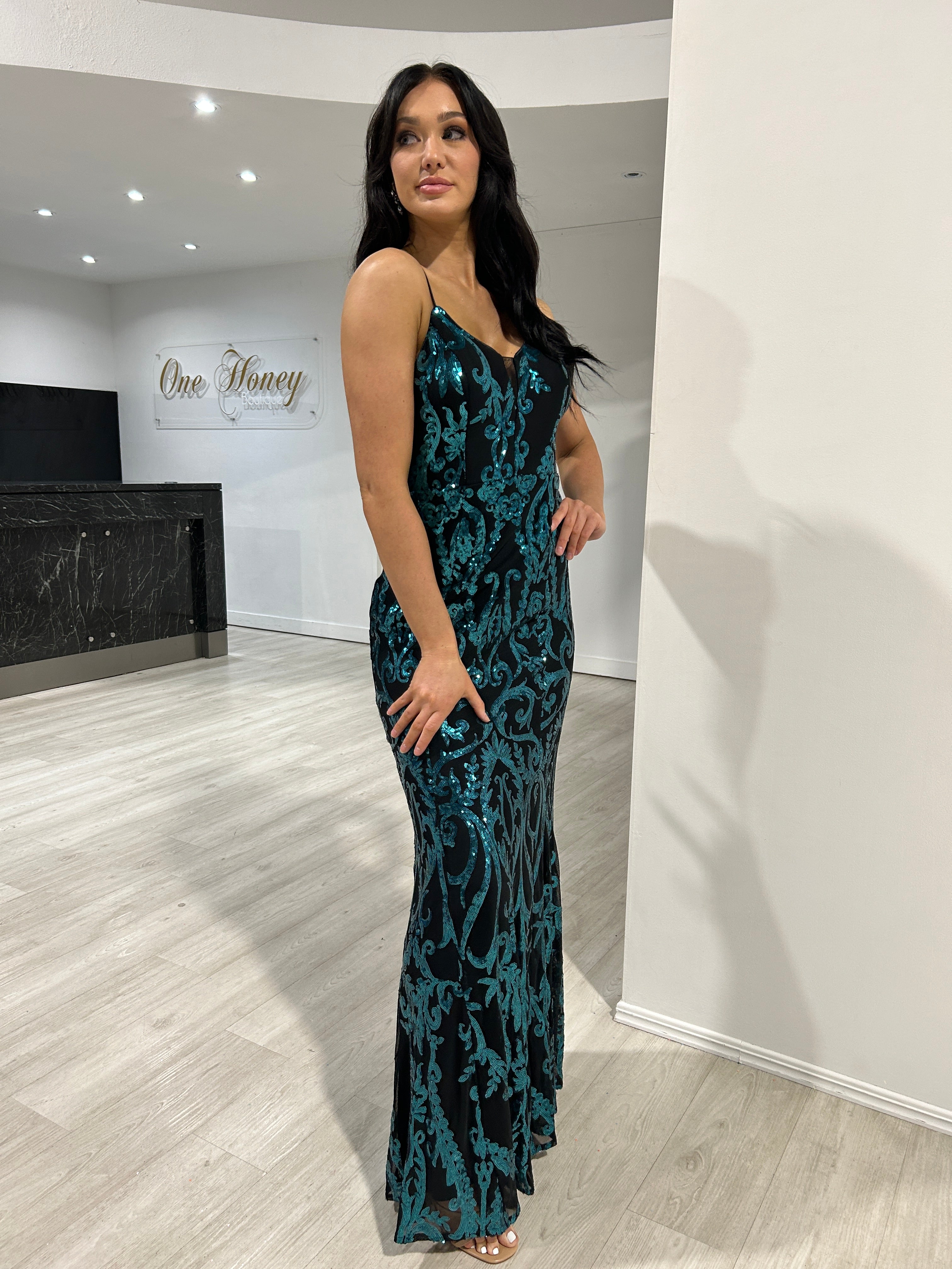 Woman in Honey Couture CARTIER black and emerald green sequin formal dress, Australian designer, perfect for prom, elegant eveningwear.