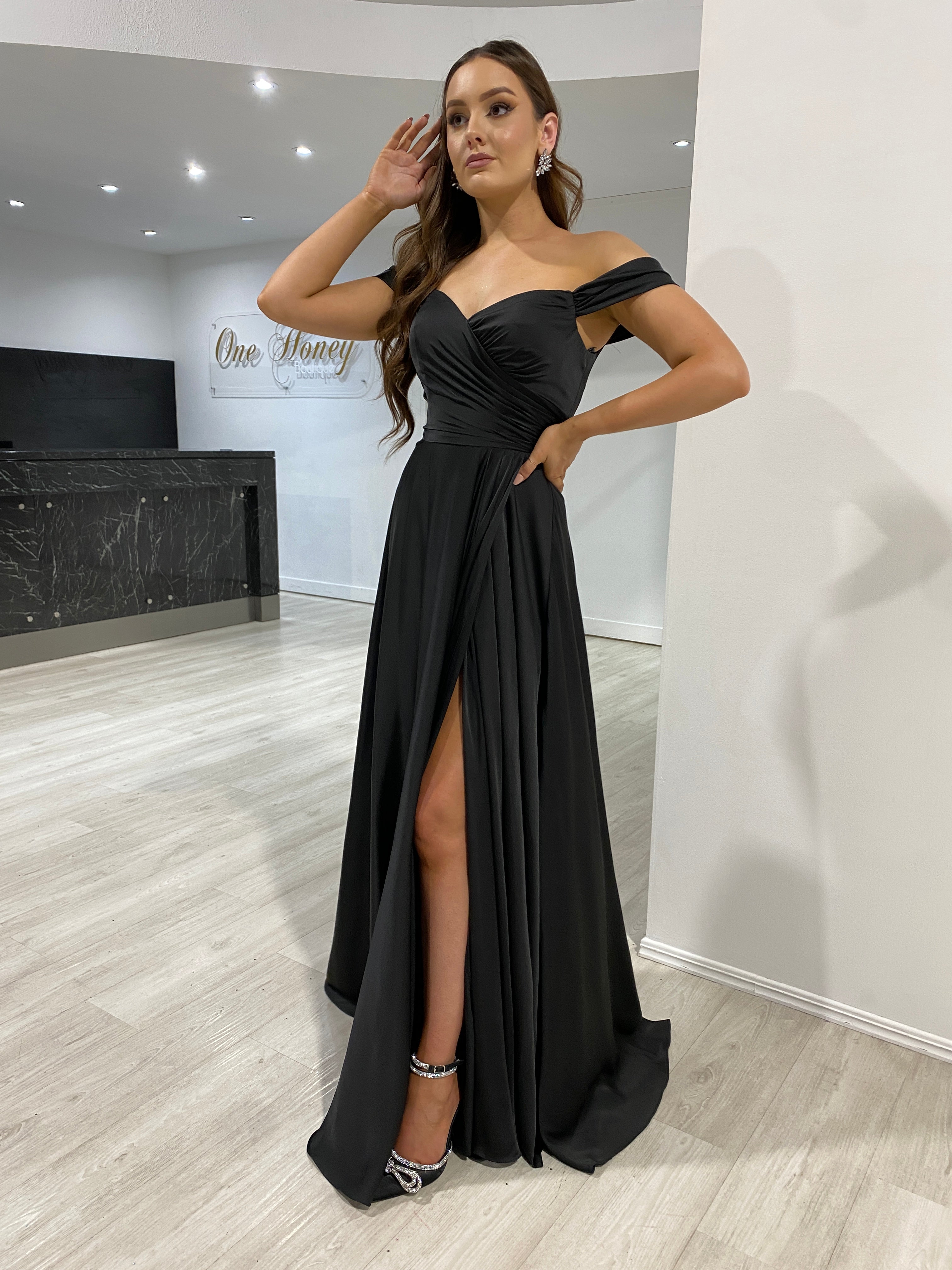 AURA Off the Shoulder Silky Black Dress with Side Slit, perfect for bridesmaid or formal events. Elegant evening gown, Brisbane to Gold Coast.