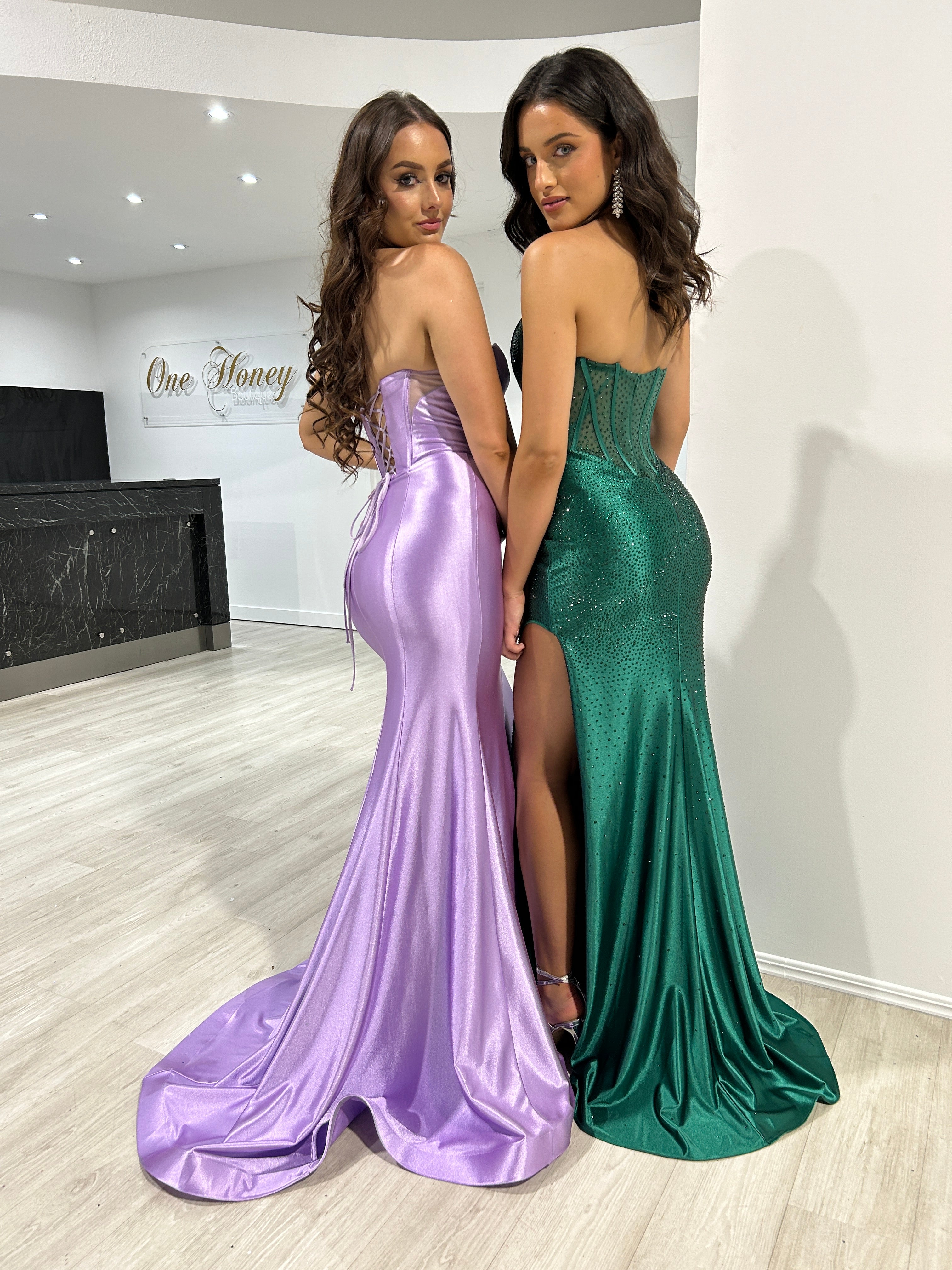 ROMANA Strapless satin corset formal dress with hot stone details, worn by two models showcasing purple and green versions. Brisbane to Gold Coast.