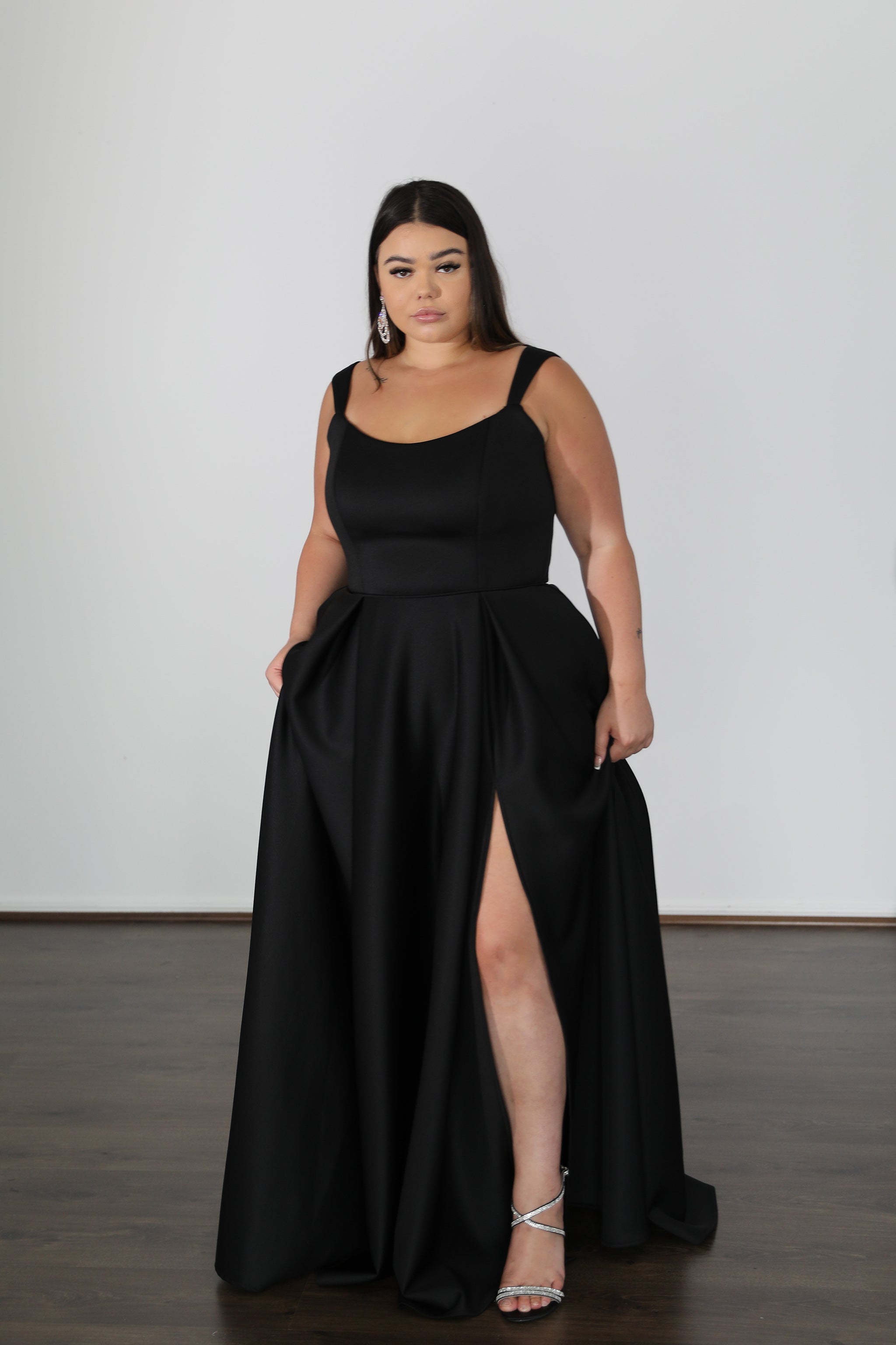 HAYLEY black scuba school formal dress with thigh-high slit. Modern plus size gown with curved neckline, Brisbane to Gold Coast.