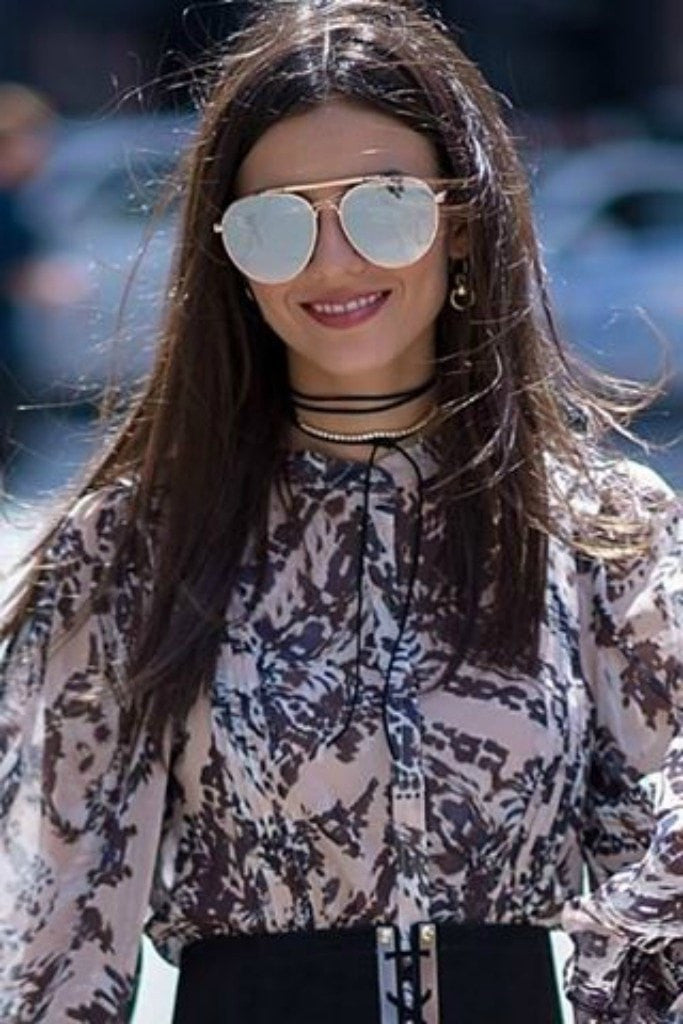 QUAY Australia LICKETY SPLIT sunglasses with mirrored lenses, worn by a woman in patterned blouse. Brisbane to Gold Coast.