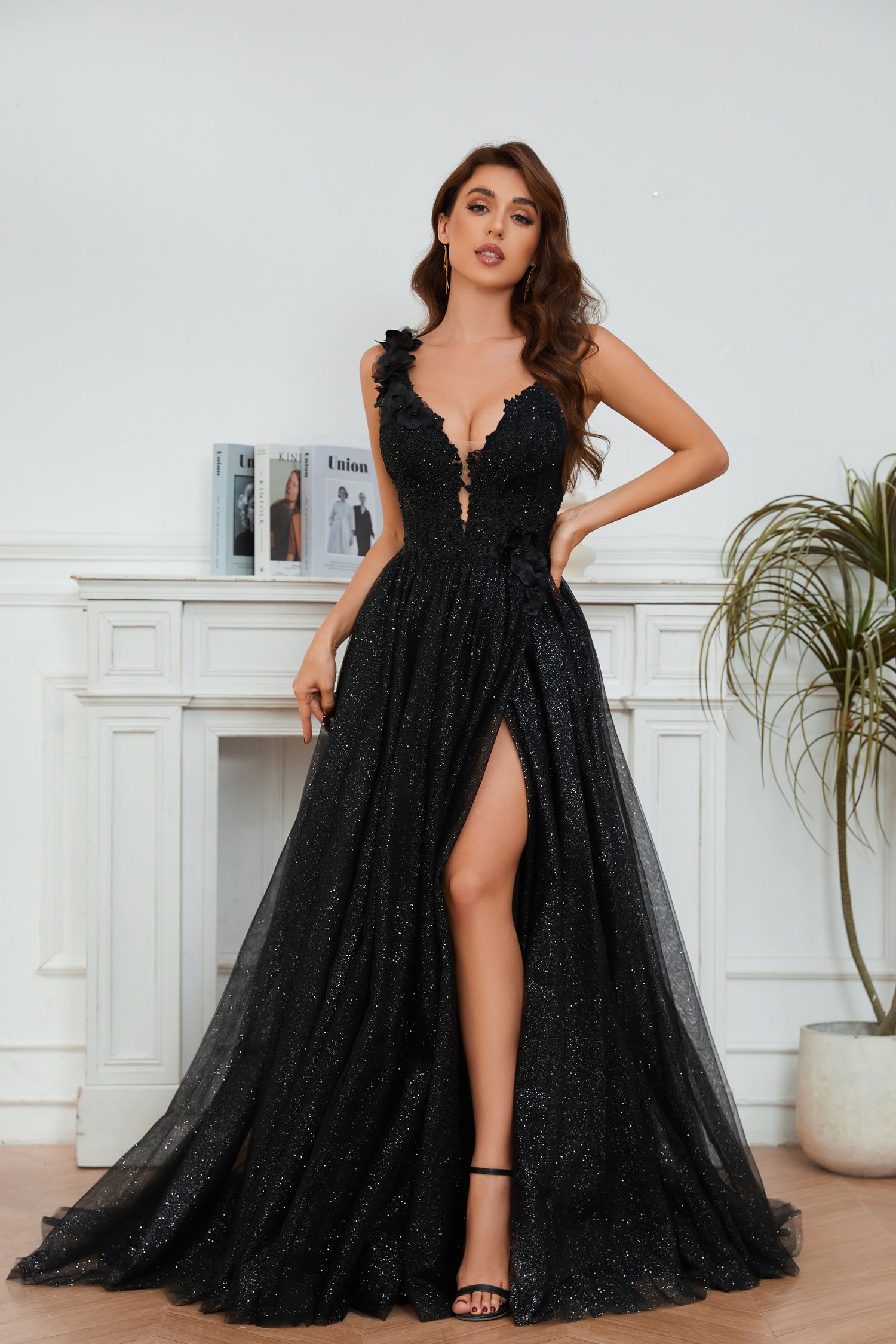Elegant black deep V-neck gown with a high leg slit and floral lace detailing, perfect for formal events. From Brisbane to Gold Coast.